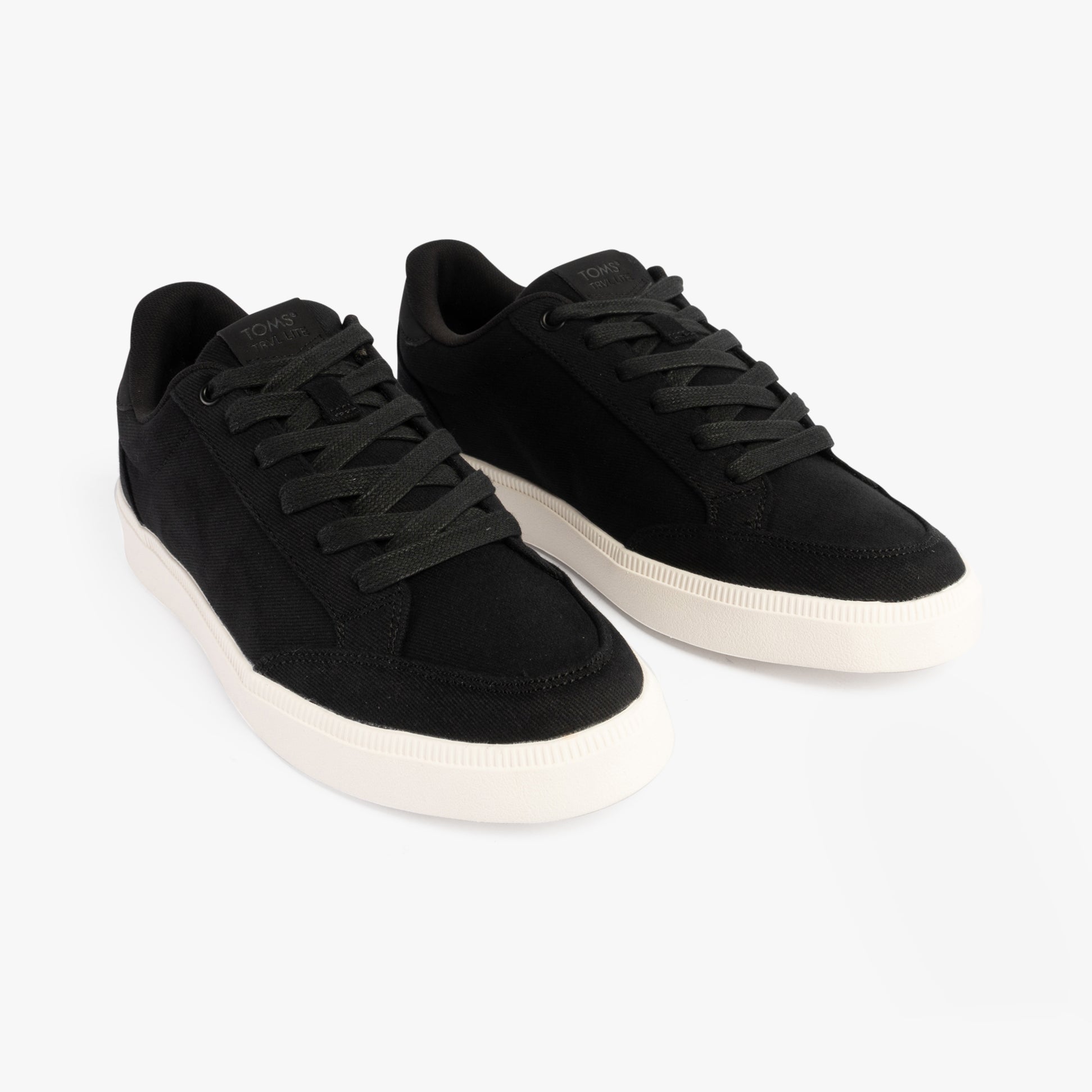 TOMS TRVL LITE RIO Mens Trainers Black side view showcasing lace-up design and relaxed fit.
