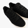 TOMS TRVL LITE RIO Mens Trainers Black top view showcasing textile upper and lace-up design.