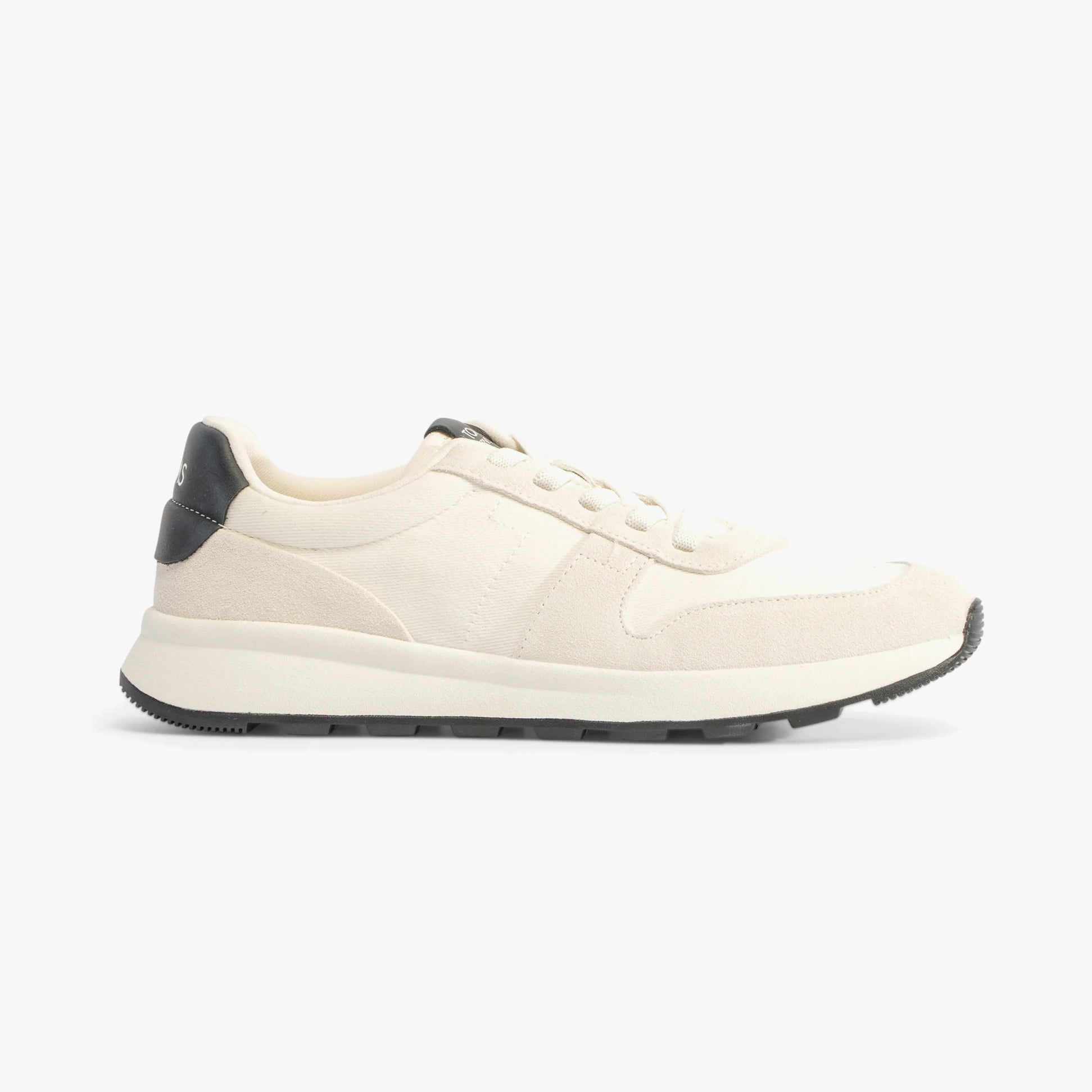 Side view of TOMS TRVL LITE RETRO Mens Trainers White showcasing suede upper and rubber sole.