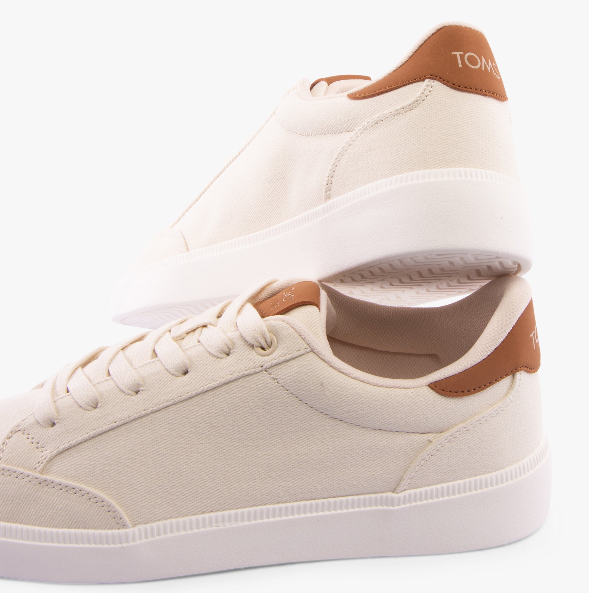 TOMS TRVL LITE RIO Mens Trainers Beige side view showcasing textile upper and rubber sole