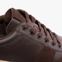 TOMS TRVL LITE COURT Mens Trainers Brown detail view showcasing leather and suede upper with lace-up design.