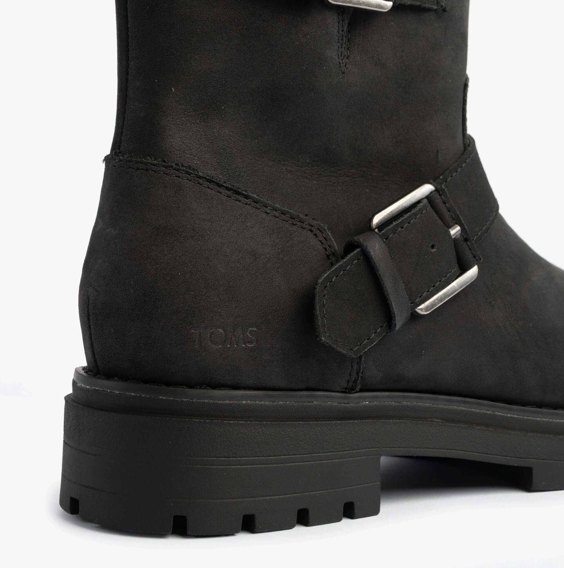 TOMS IONIE MOTO Womens Ankle Boots Black detail view showcasing the leather upper and buckle design.