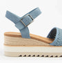 TOMS DIANA Womens Sandals Blue side view showcasing textile upper, wedge heel, and buckle closure.