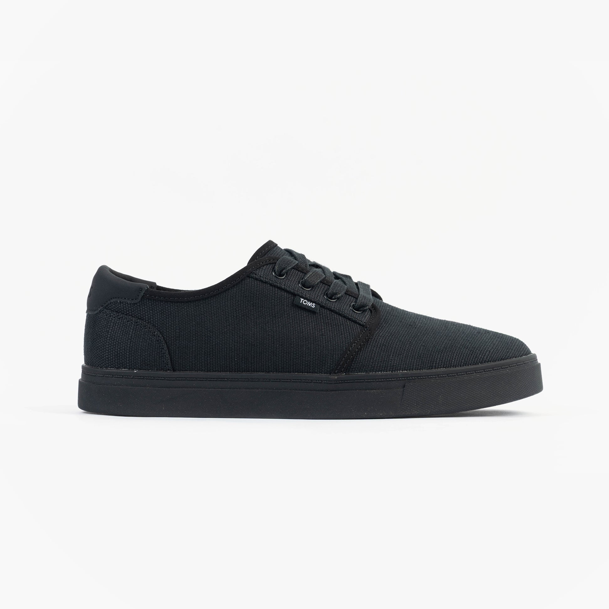 TOMS CARLO 2.0 Mens Trainers Black side view showcasing canvas upper and rubber sole.