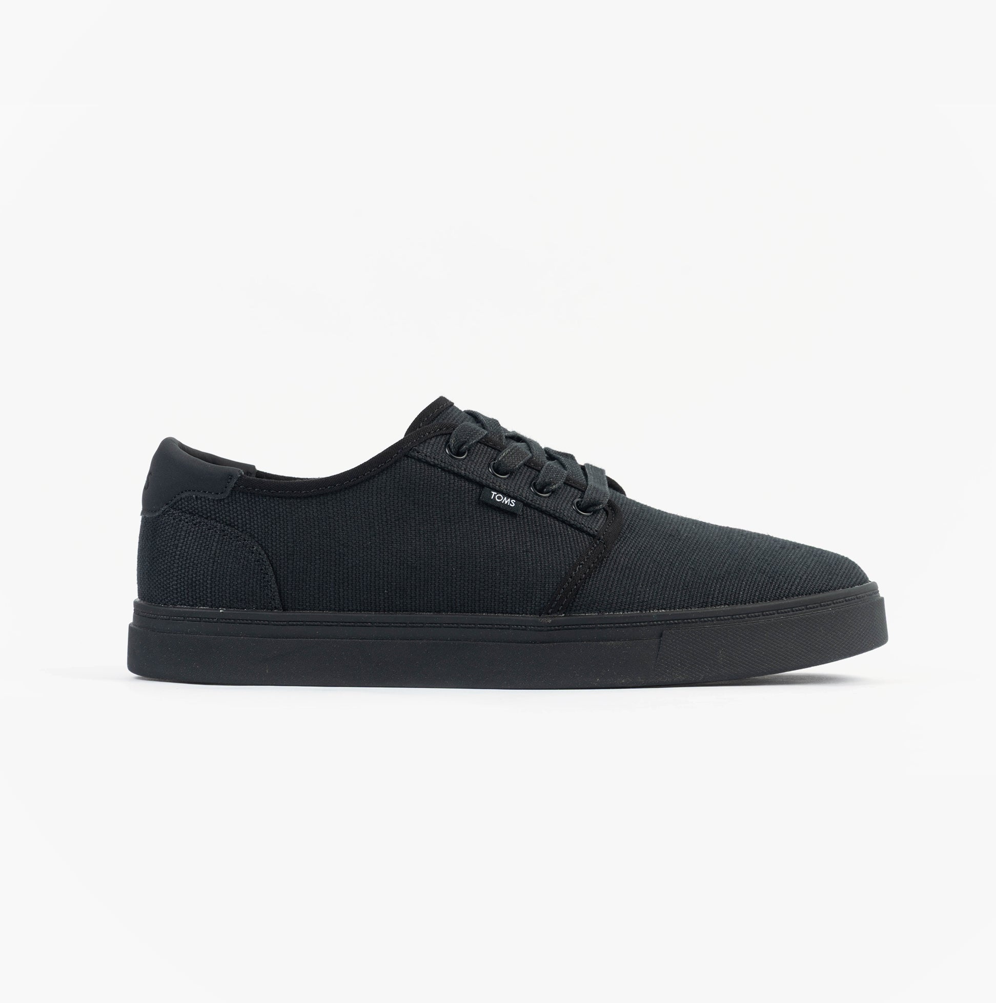 TOMS CARLO 2.0 Mens Trainers Black side view showcasing canvas upper and rubber sole.