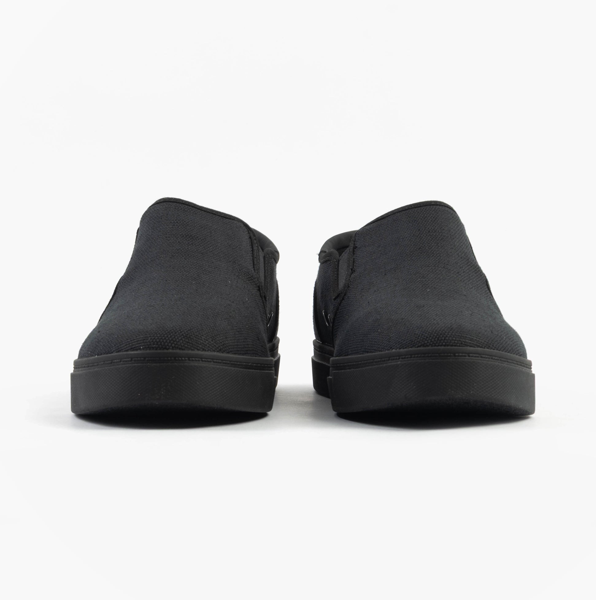TOMS BAJA 2.0 Mens Casual Canvas Trainers Black front view showcasing the slip-on design and round toe shape.