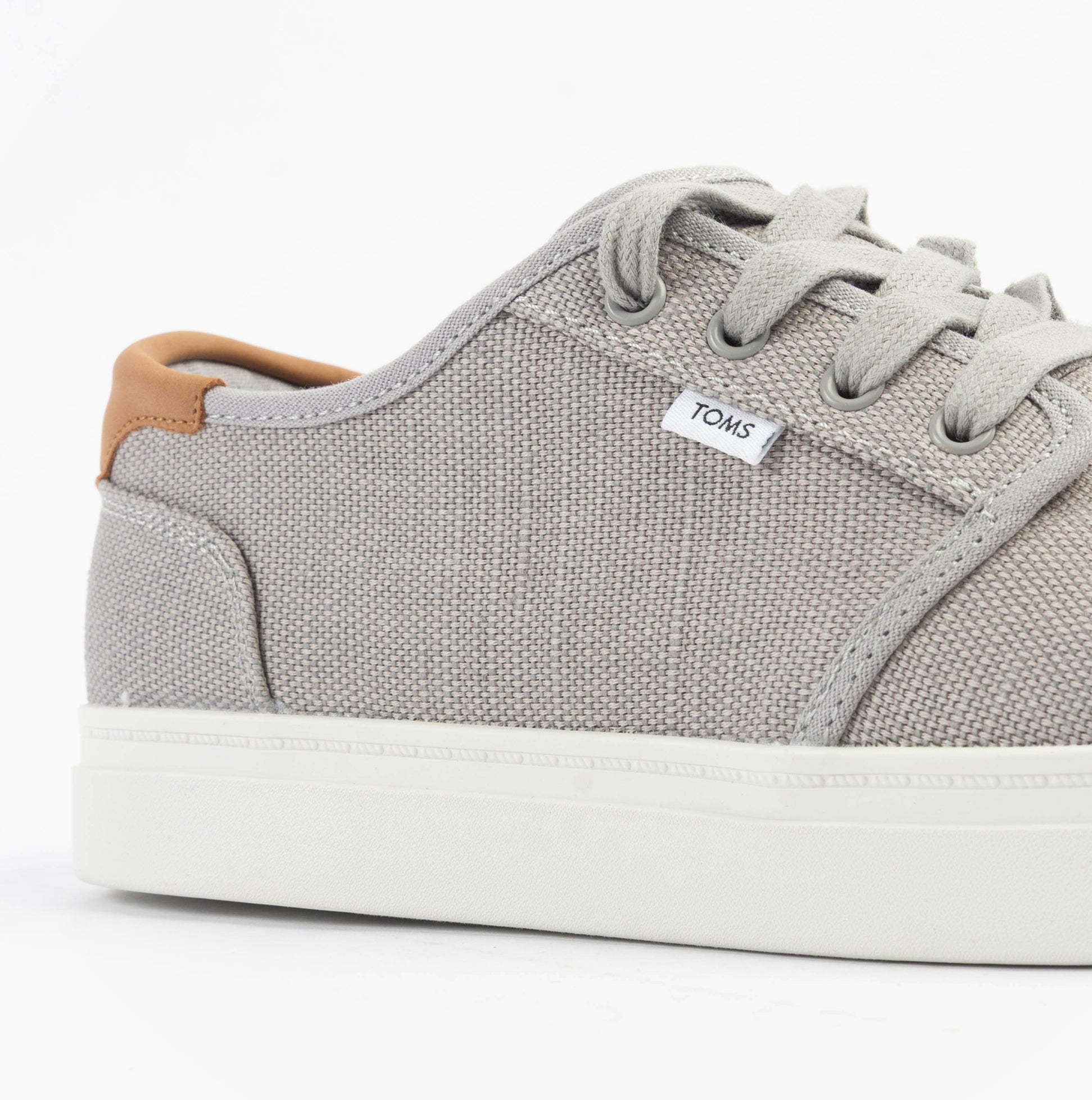TOMS CARLO 2.0 Mens Trainers Grey side view showing canvas upper and lace-up closure.
