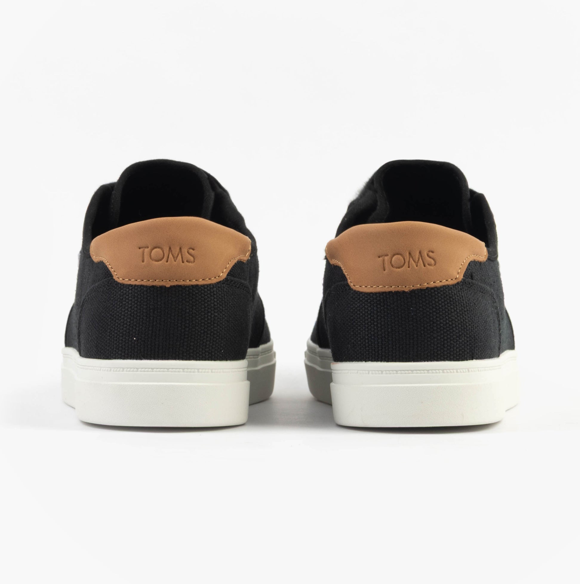 TOMS CARLO 2.0 Mens Trainers Black rear view showing canvas upper and TOMS branding on the heel.