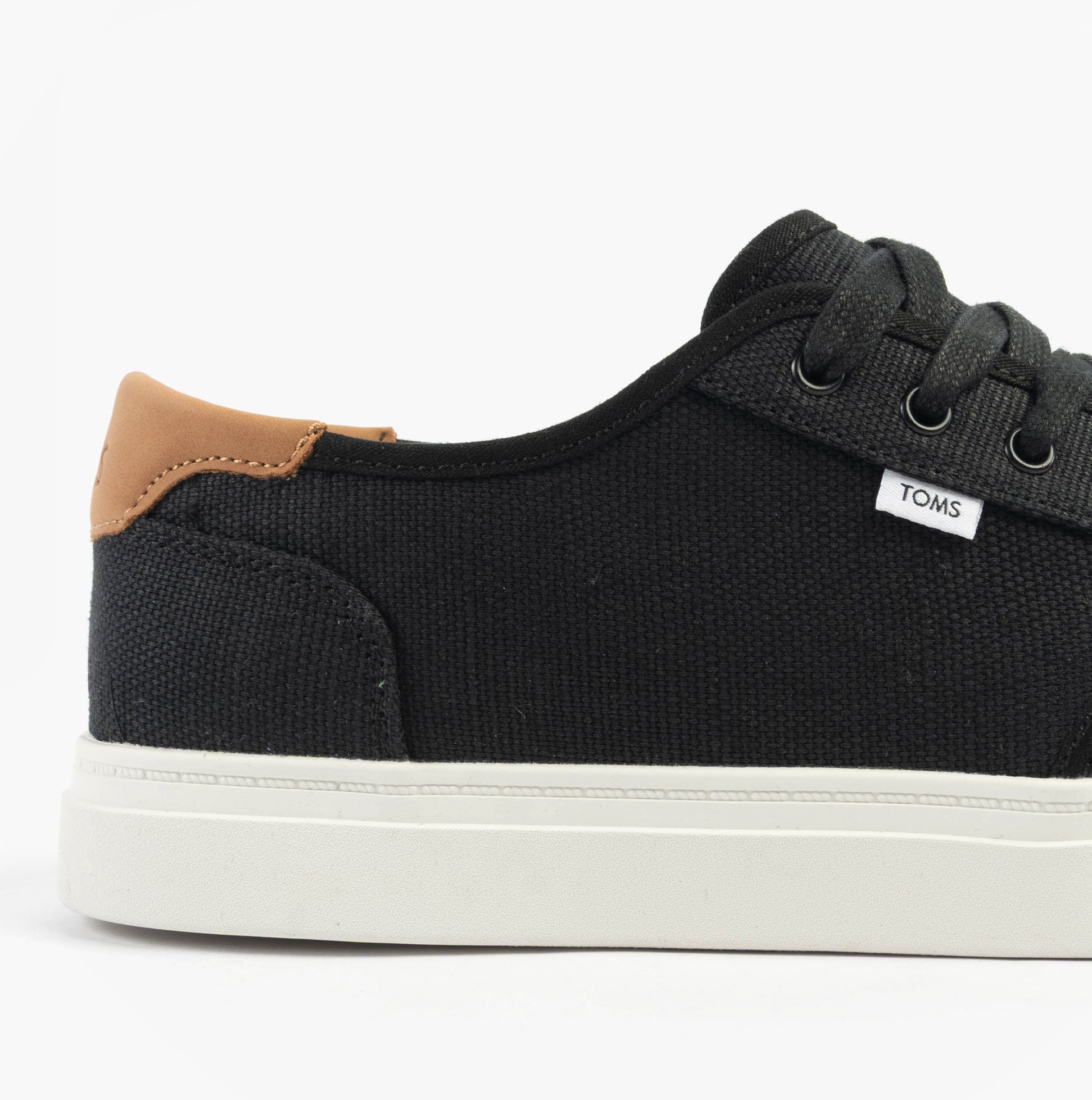 TOMS CARLO 2.0 Mens Trainers Black side view with canvas upper and lace-up closure.