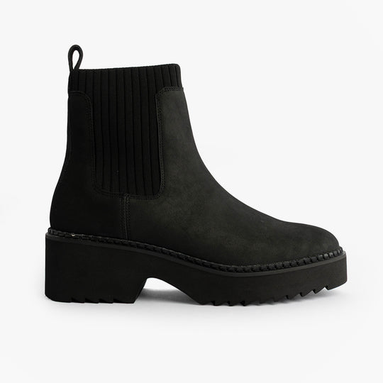 TOMS MILLIE Womens Ankle Boots Black side view featuring leather upper, rubber sole, and round toe shape.