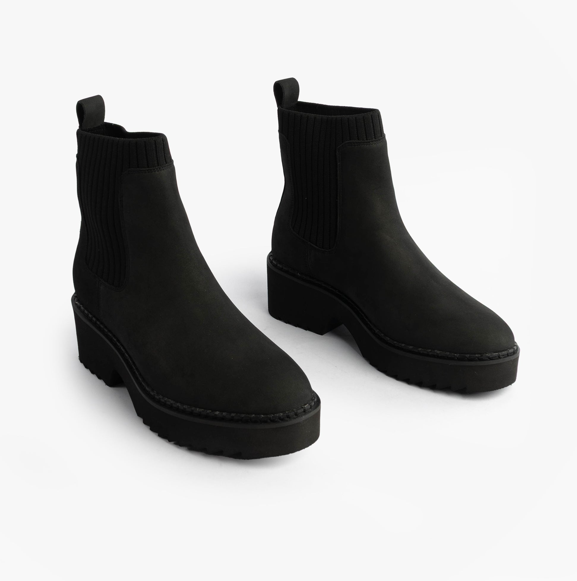 TOMS MILLIE Womens Ankle Boots Black side view showcasing sleek leather design and comfortable pull-on style.