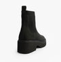 TOMS MILLIE Womens Ankle Boots Black side view showing black leather and rubber sole, highlighting Chelsea style design.