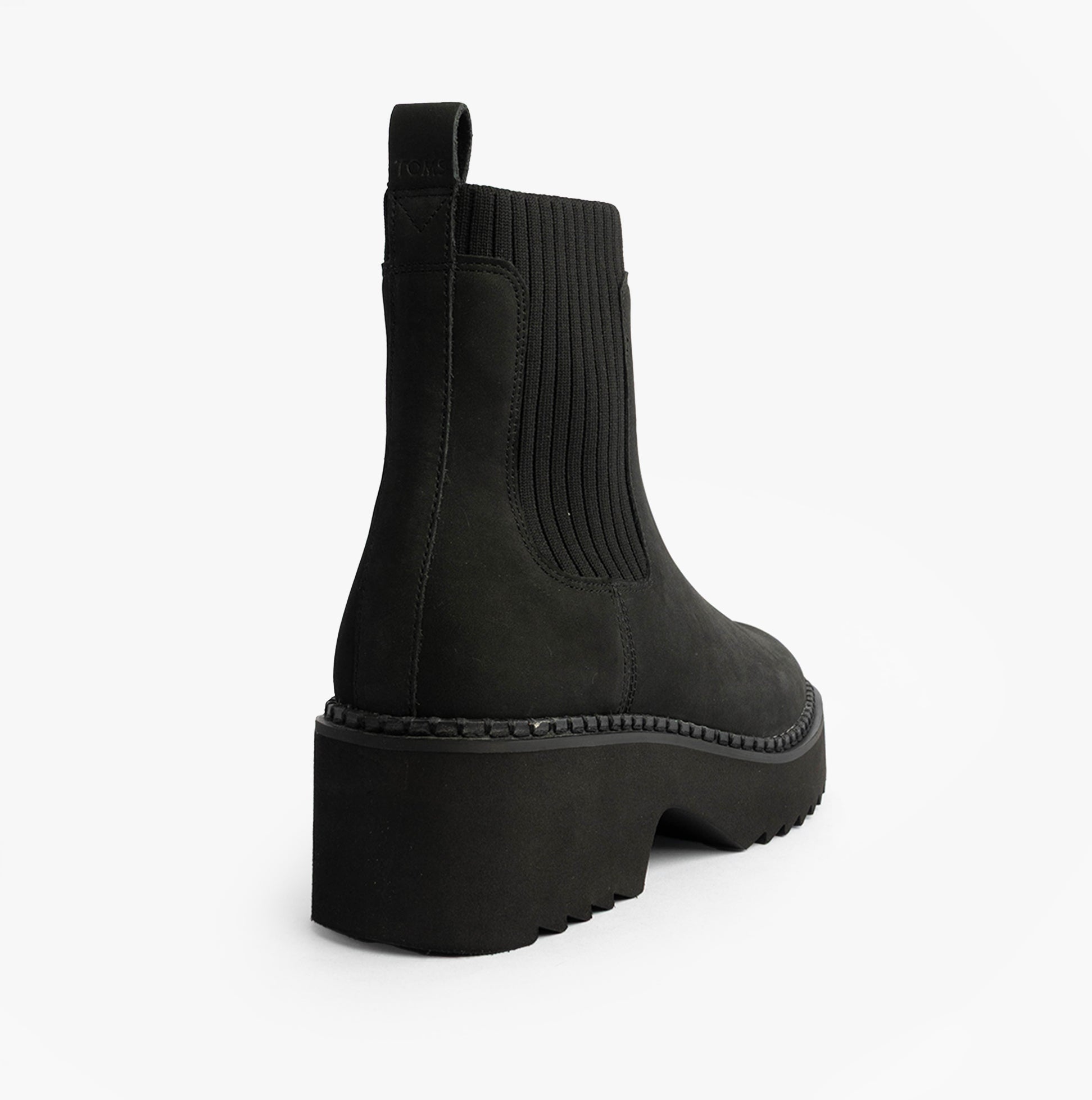 TOMS MILLIE Womens Ankle Boots Black side view showing black leather and rubber sole, highlighting Chelsea style design.