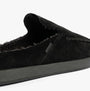TOMS ALONSO MULE Mens Faux Shearling Lined Slippers Black side view showing suede upper and warm lining detail.