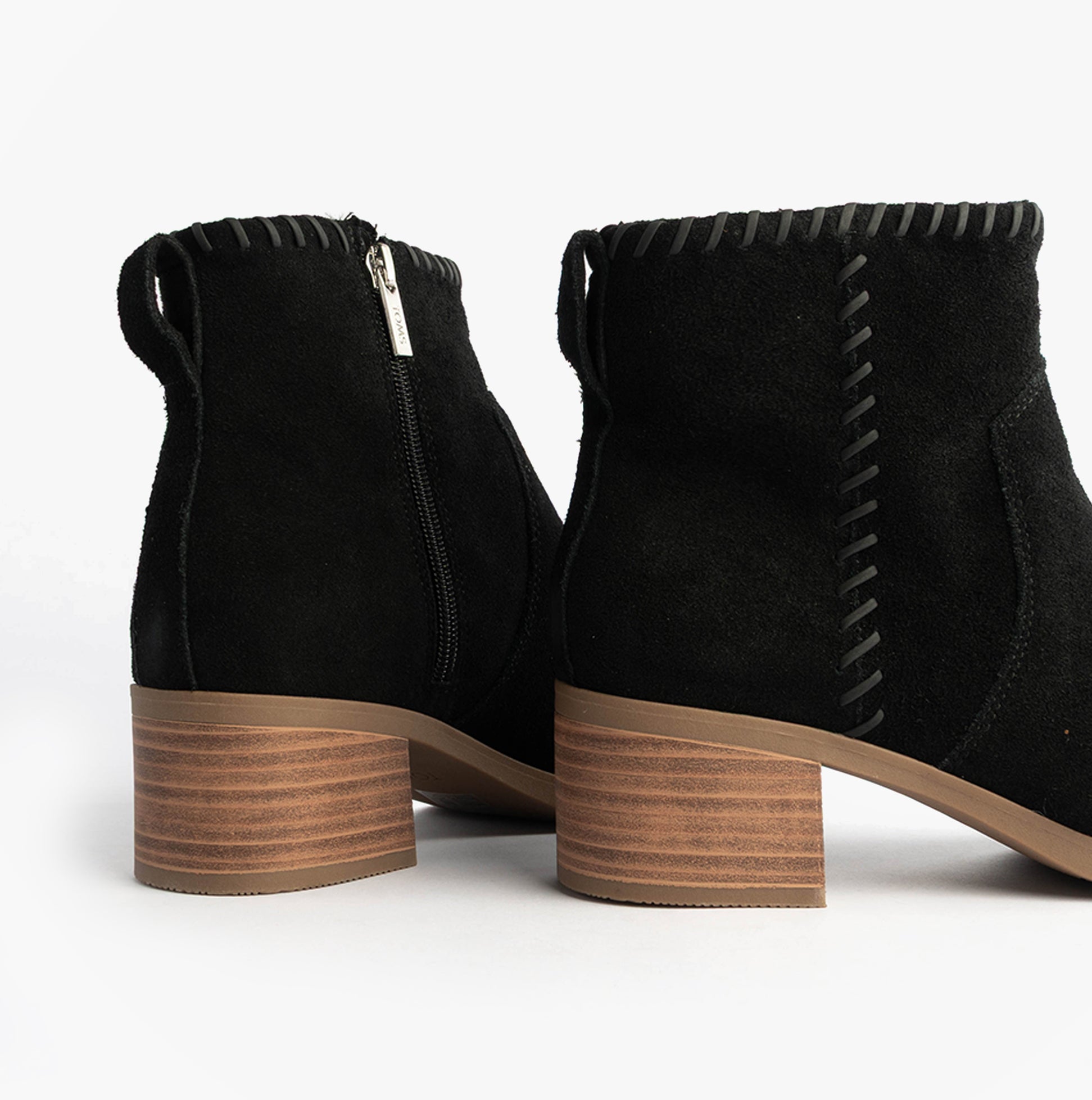 TOMS DELILAH Womens Ankle Boots Black side view showcasing the zip closure and heel detail.