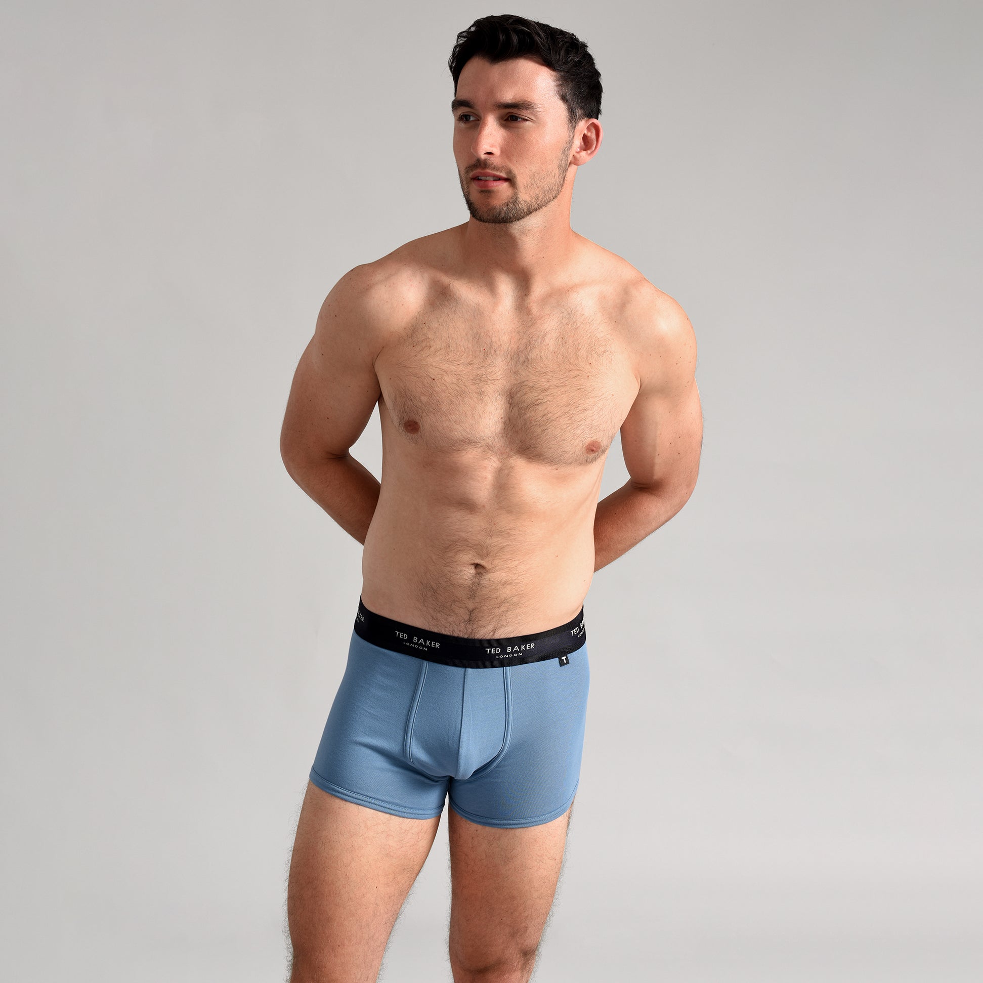 Ted Baker 3-Pack Cotton Trunks Mens Multicoloured side view of model wearing blue trunks with logo waistband