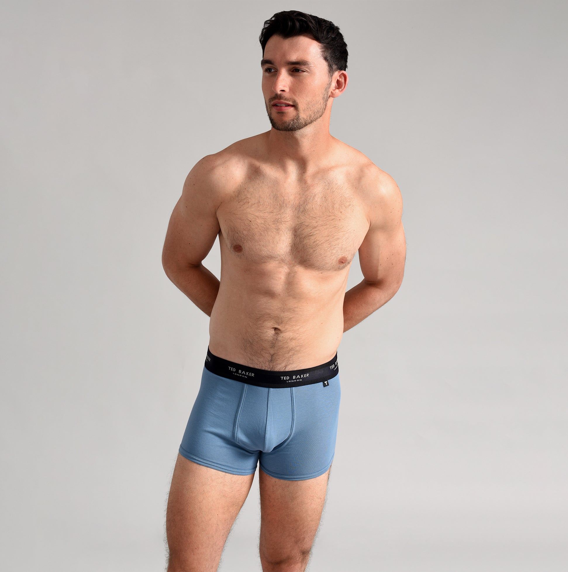 Ted Baker 3-Pack Cotton Trunks Mens Multicoloured side view of model wearing blue trunks with logo waistband