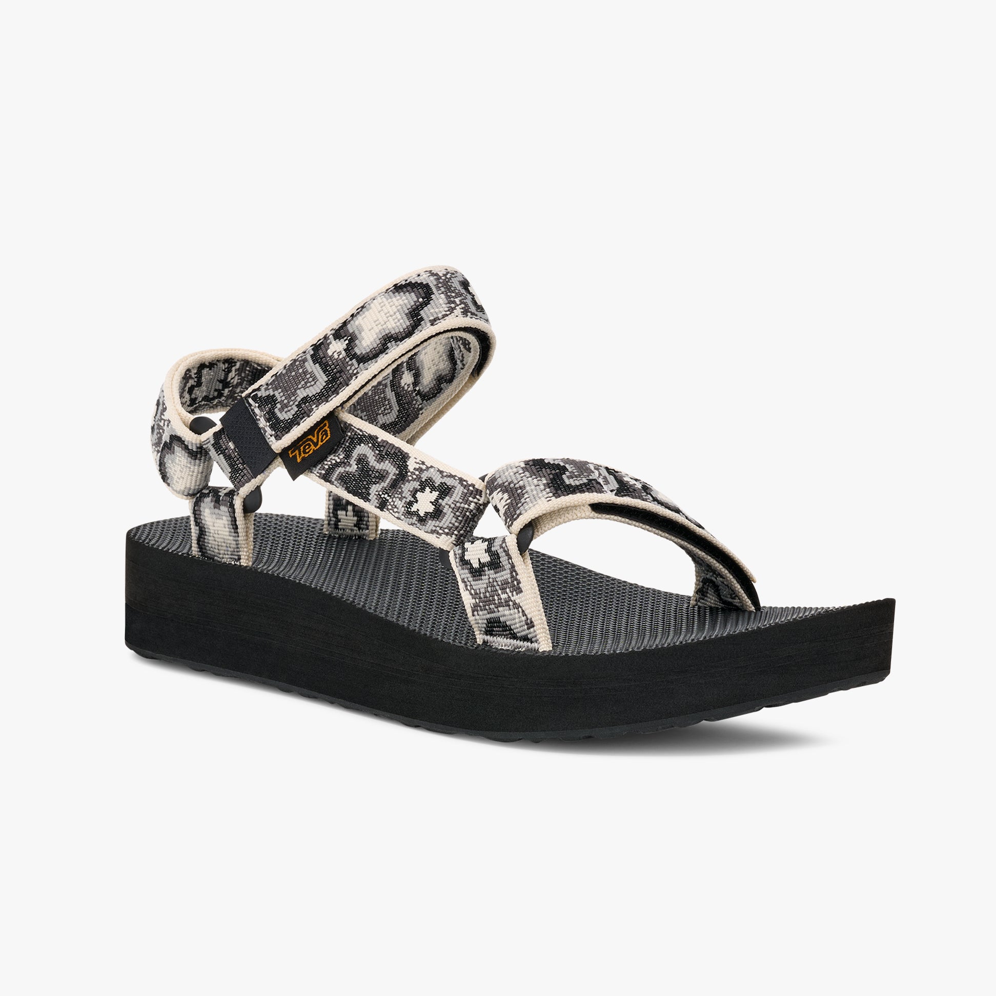 Teva MIDFORM UNIVERSAL Womens Sandals Neon Floral Black/ White side view showcasing platform heel and strap details.