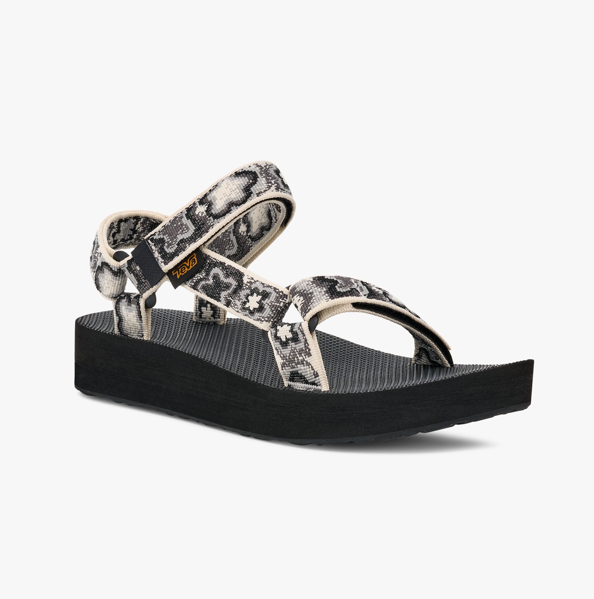 Teva MIDFORM UNIVERSAL Womens Sandals Neon Floral Black/ White side view showcasing platform heel and strap details.
