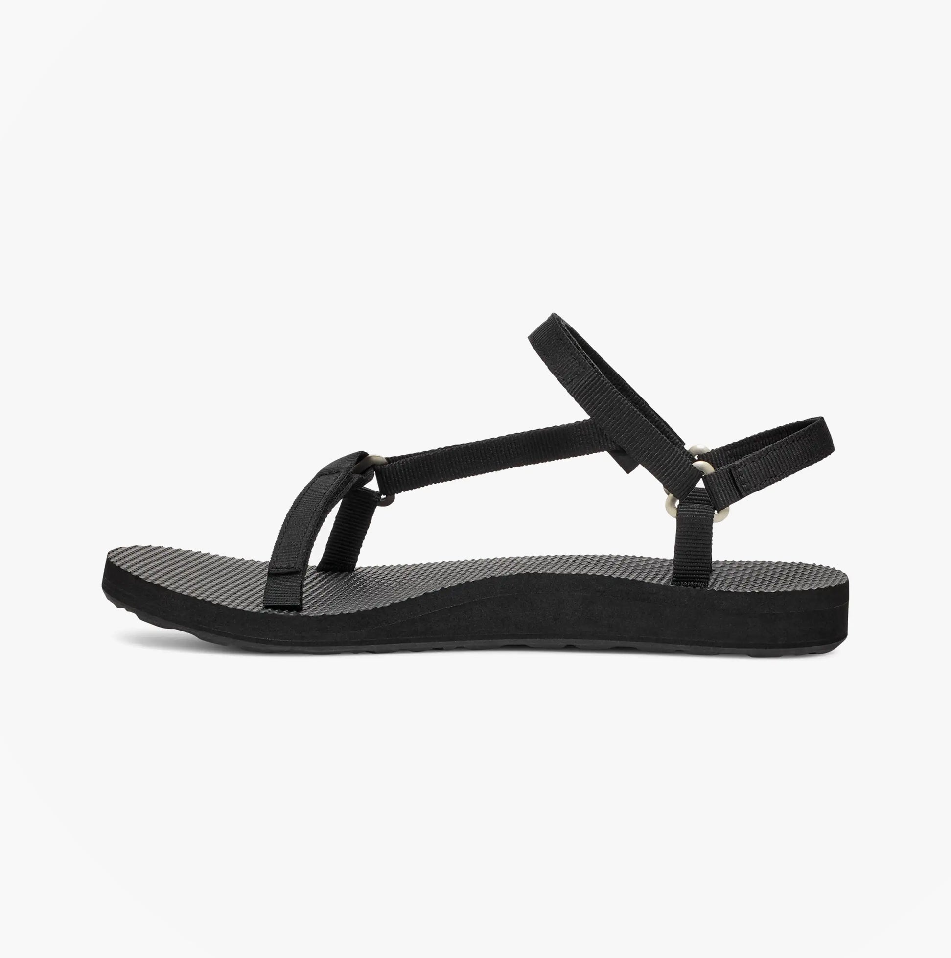 Teva ORIGINAL UNIVERSAL Womens Sandals Slim Black side view showcasing lightweight design and adjustable strap.