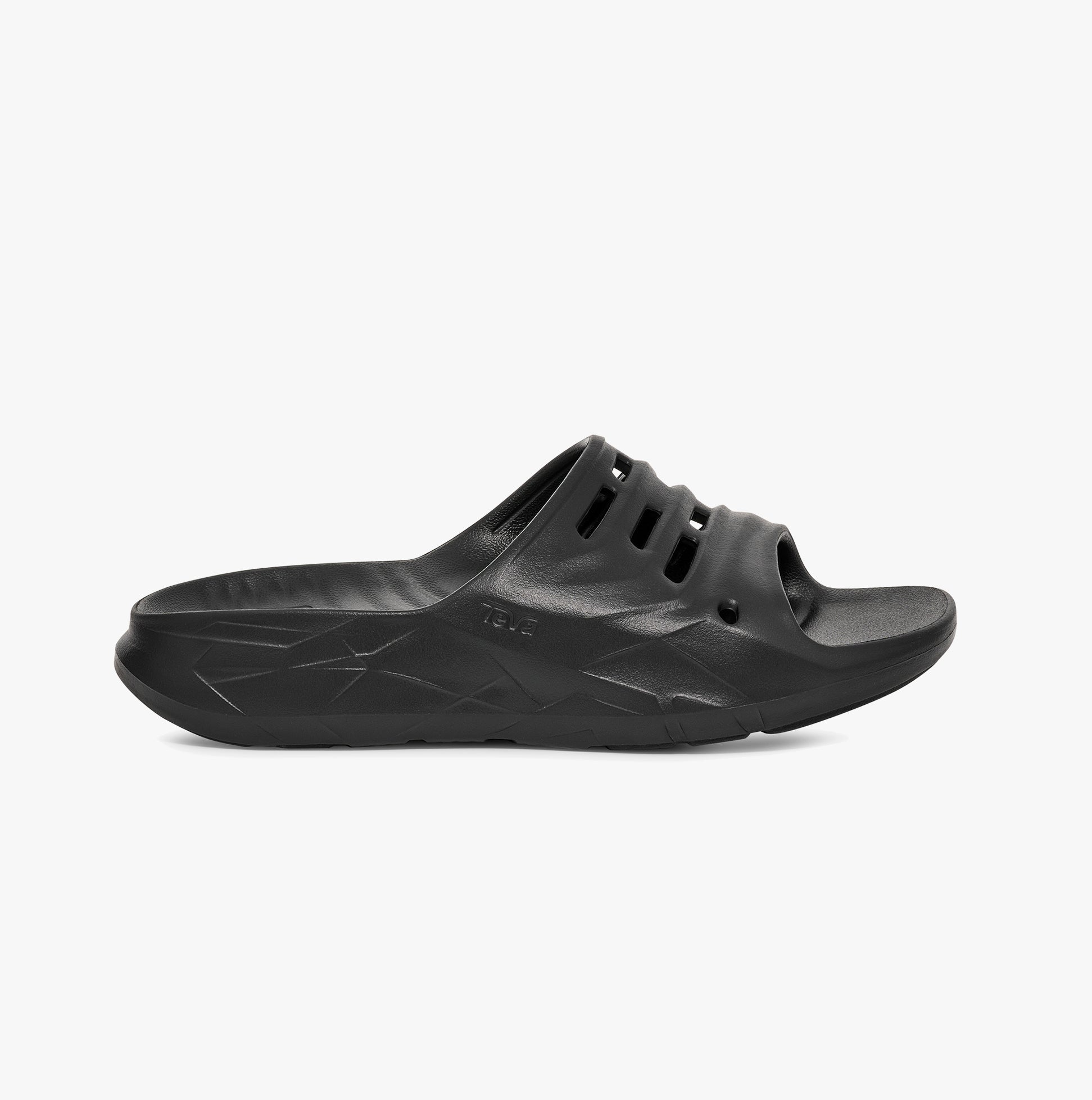 Teva Womens APRE TRAIL Sliders Black side view featuring lightweight EVA material and relaxed slip-on design.