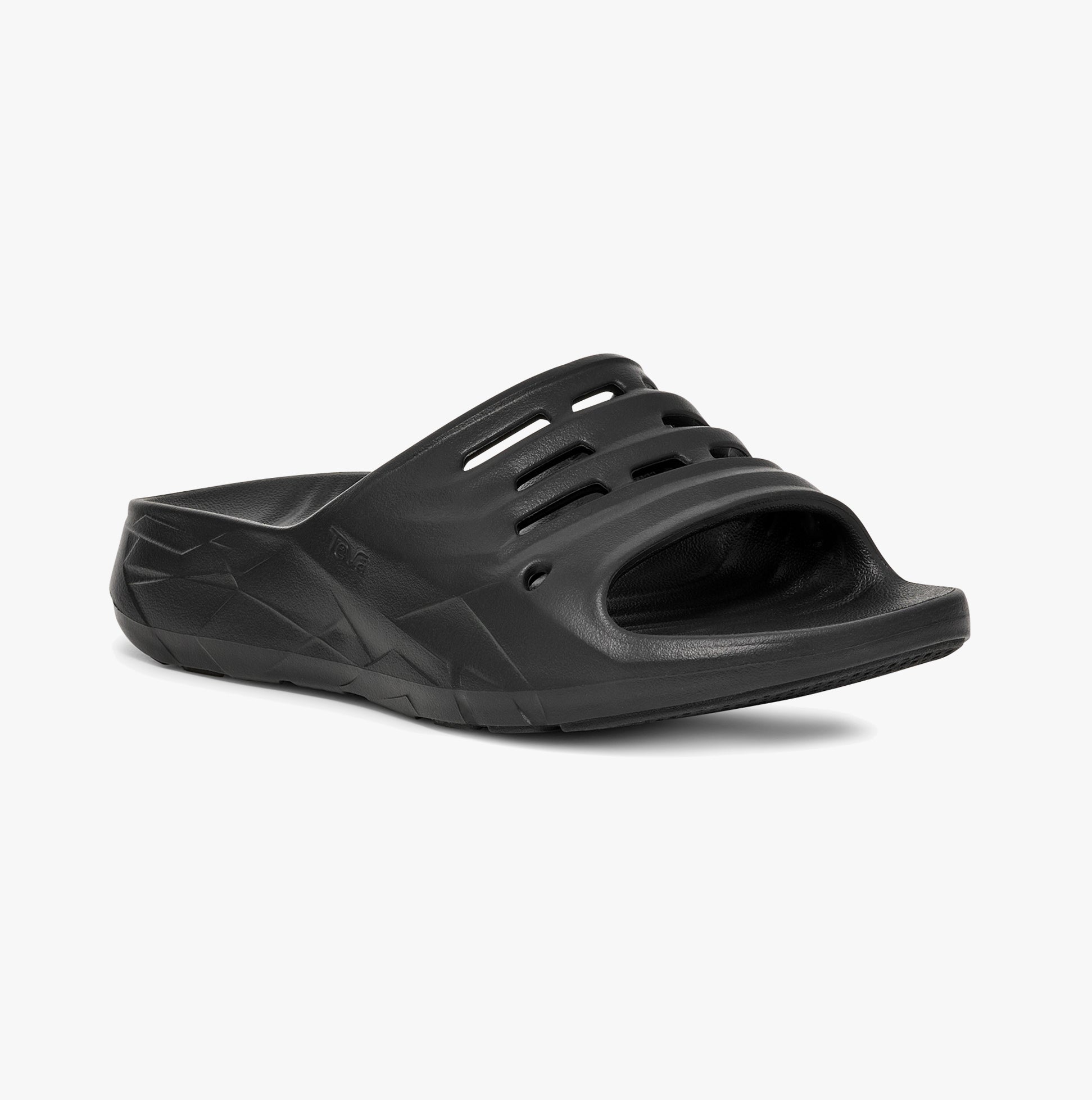 Teva Womens APRE TRAIL Sliders Black side view showing lightweight EVA material and slip-on design.