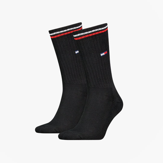Tommy Hilfiger 2 Pack Trainer Mens Crew Socks Black side view showcasing black fabric and red-striped design.
