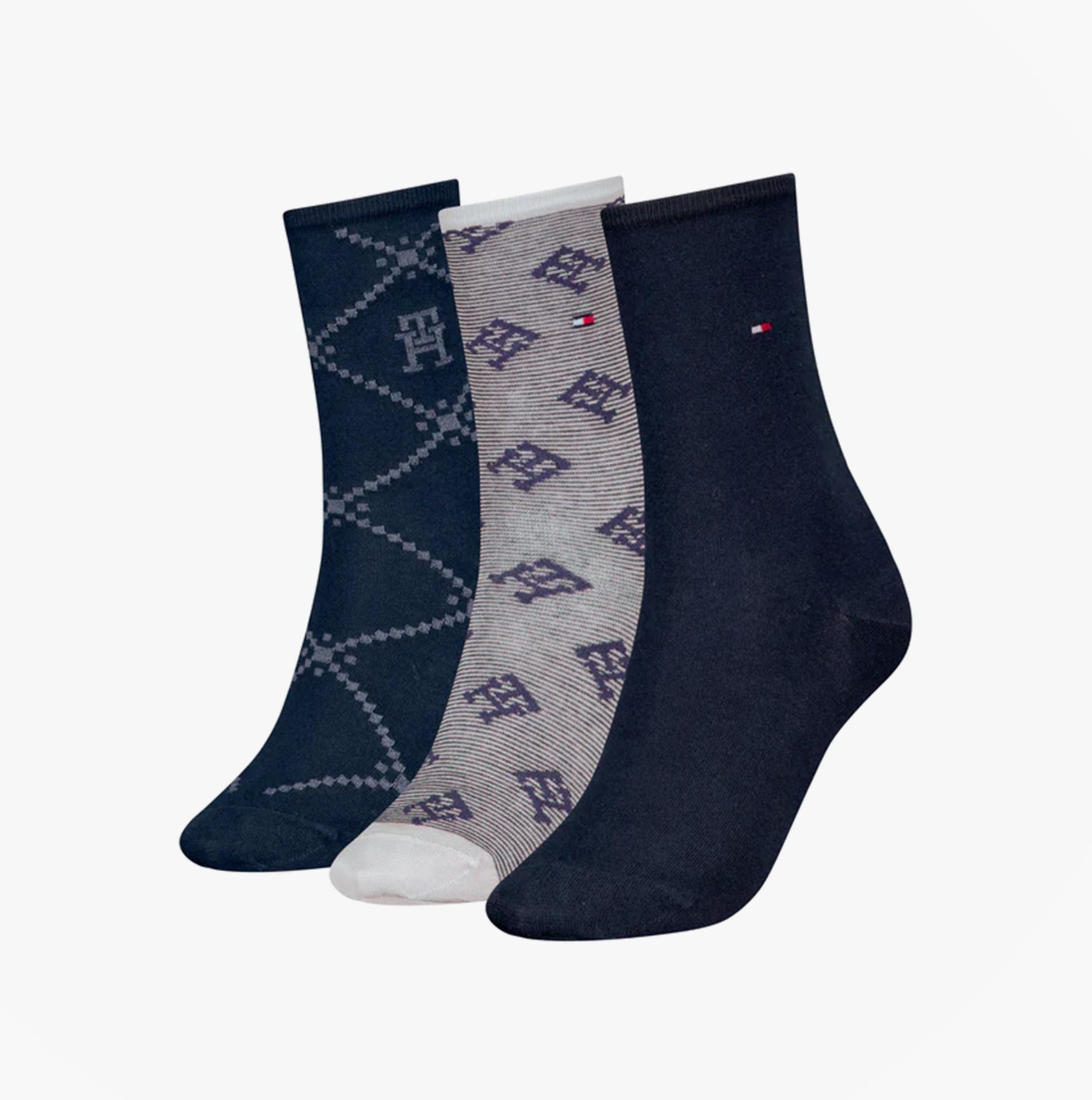 Tommy Hilfiger 3 Pack Giftboxed Monogram Womens Crew Socks Navy side view showcasing navy and patterned designs.