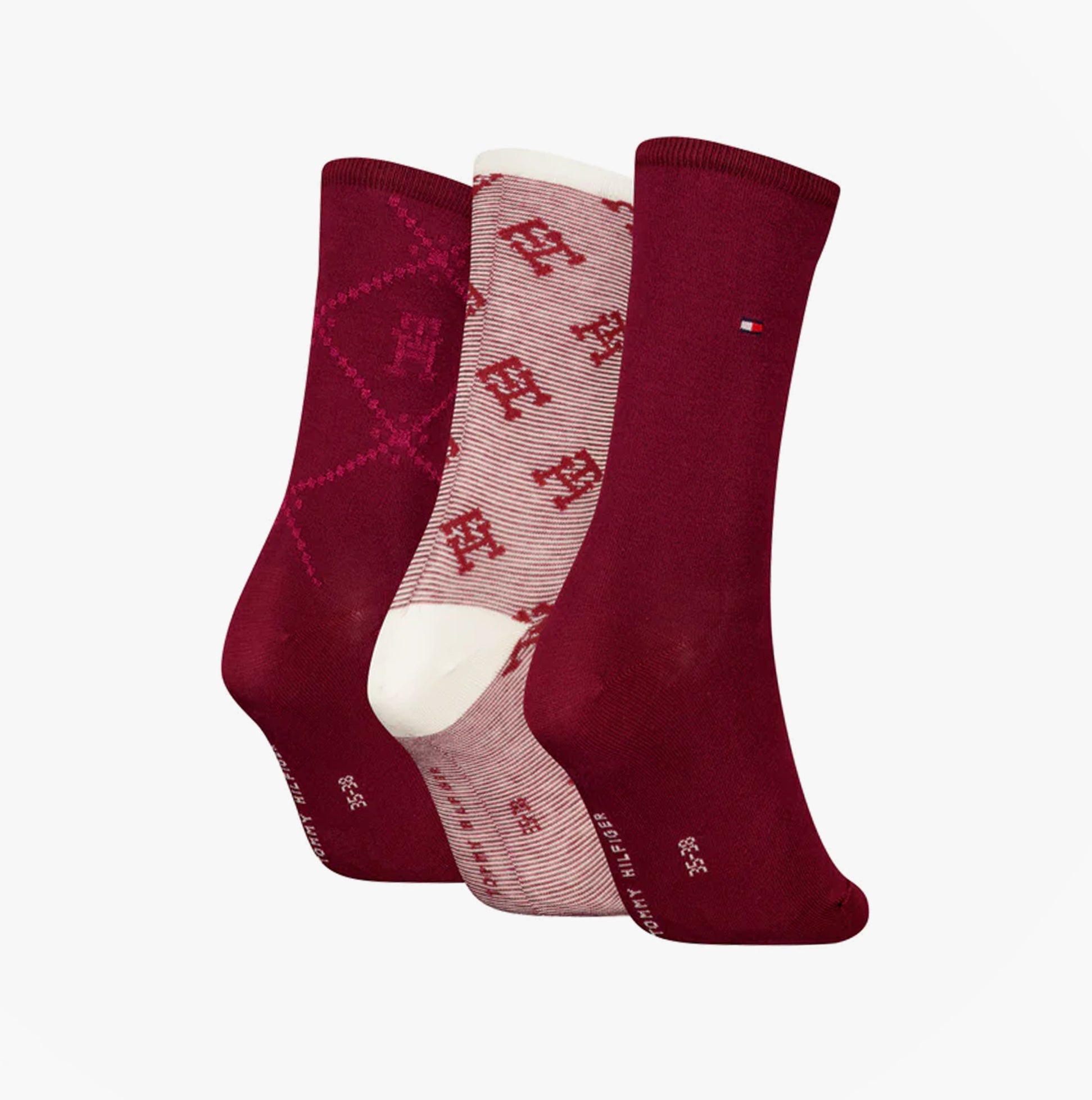 Tommy Hilfiger 3 Pack Giftboxed Monogram Womens Crew Socks Red front view showcasing three pairs in different red patterns.