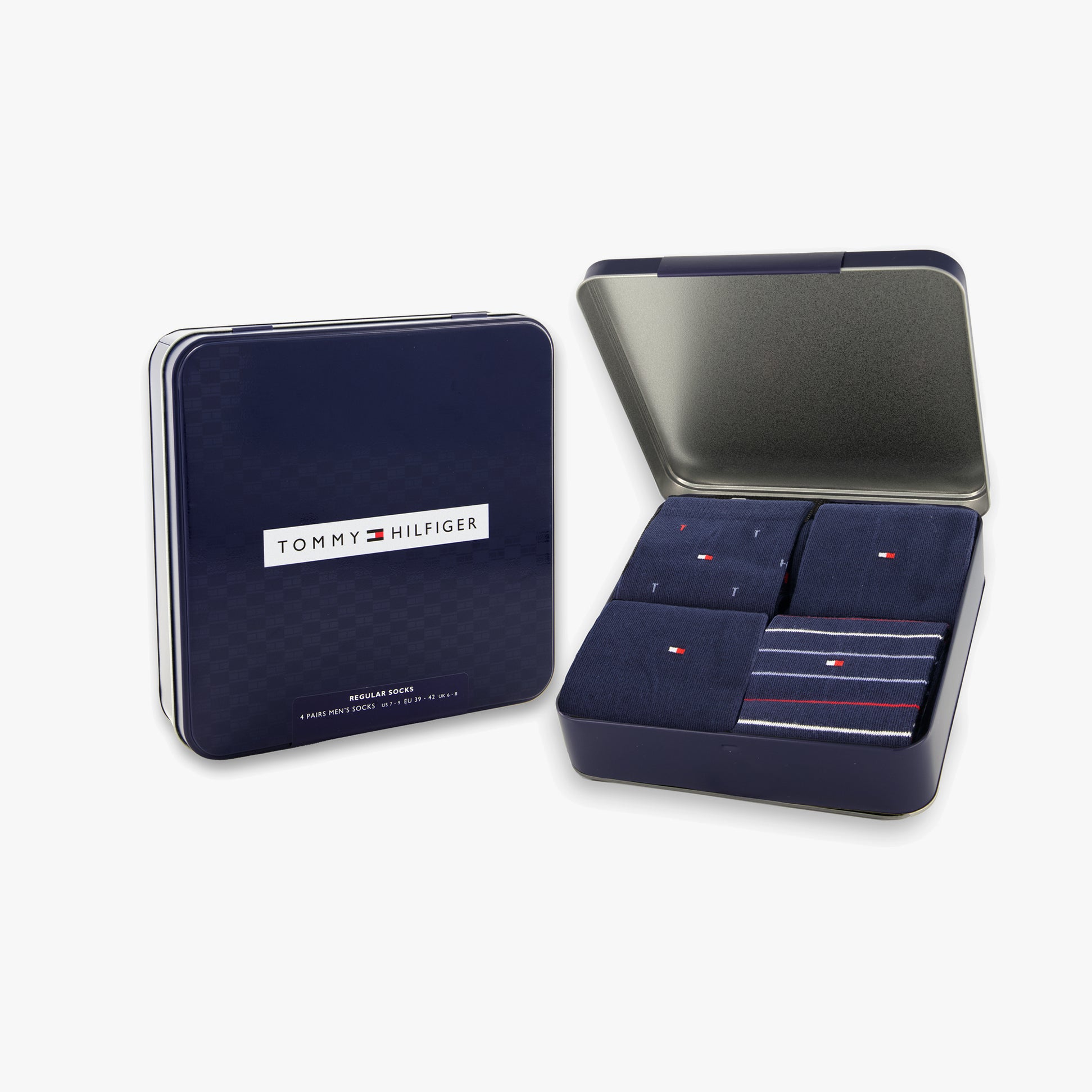 Tommy Hilfiger 4 Pack Giftbox Mens Socks Navy in an open gift box showcasing four pairs of socks, including striped designs.