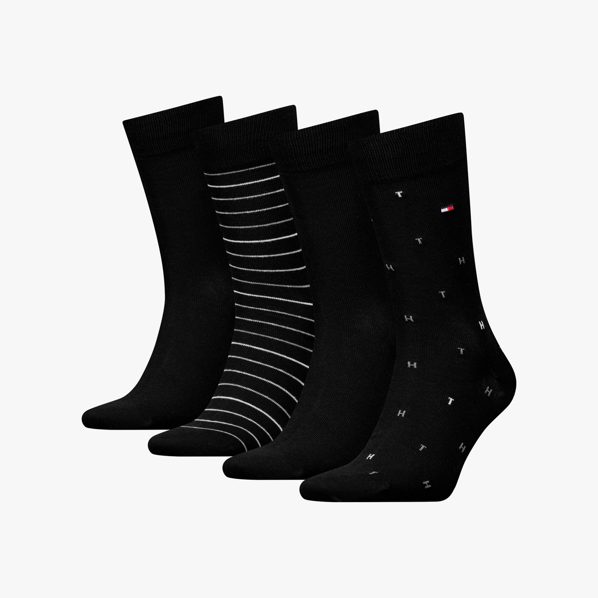 Tommy Hilfiger 4 Pack Giftbox Mens Socks Black featuring four different designs in a close-up view.
