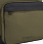 Detail view of Tommy Hilfiger REPREVE Metal Logo Backpack Army Green showing front pocket and brand logo.