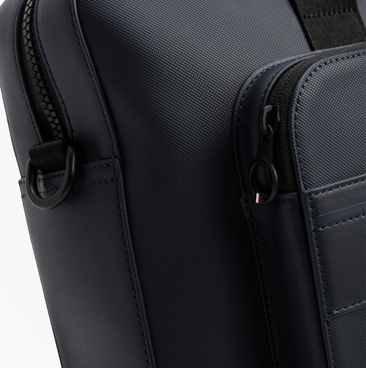 Tommy Hilfiger Signature Laptop Bag Navy detail view showing zip closure and pebble grain finish.