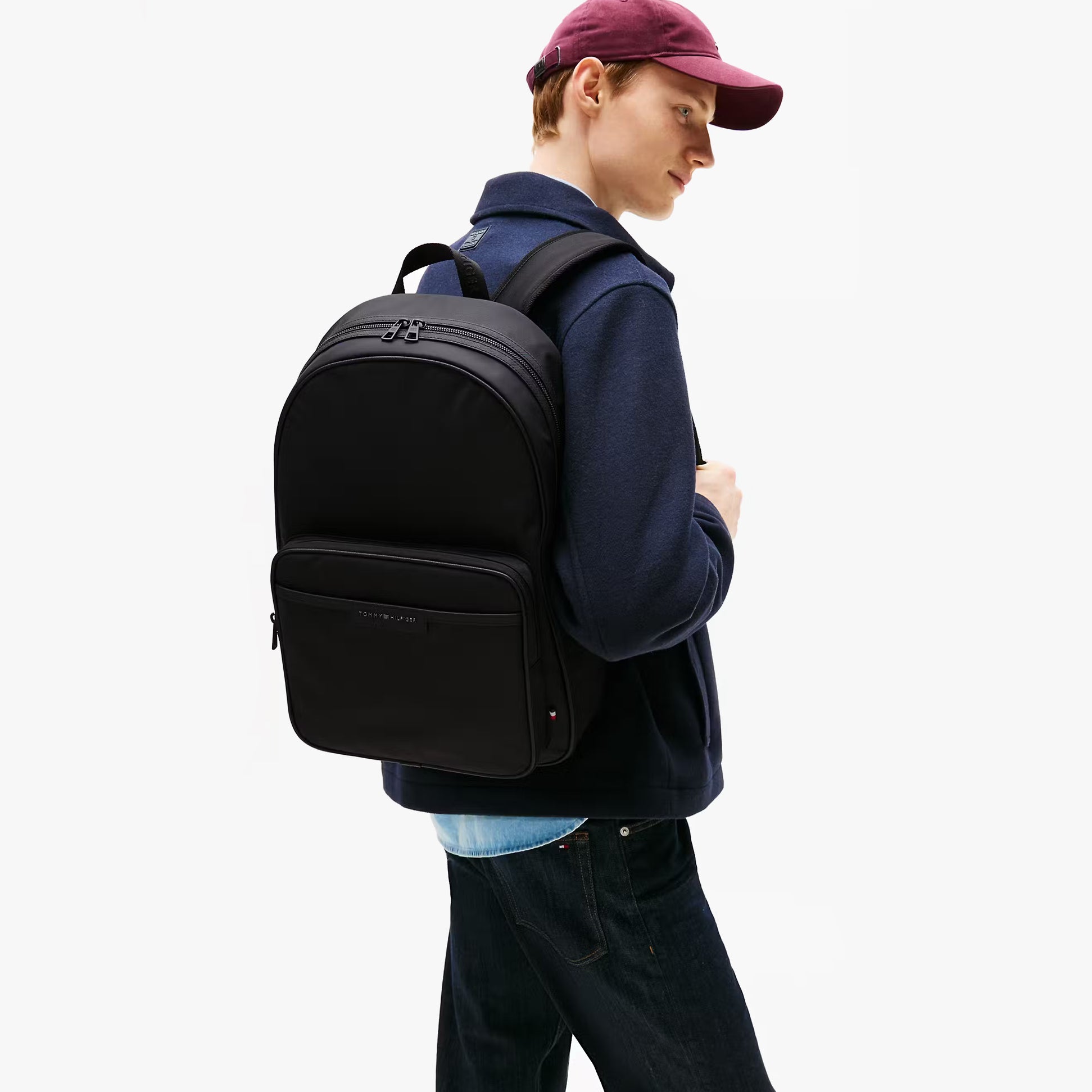 Tommy Hilfiger REPREVE Mens Backpack/Rucksack Black side view worn by a model
