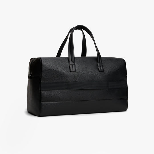 Tommy Hilfiger CENTRAL DUFFLE Mens Duffle Bag Black side view with zip closure and sleek design.