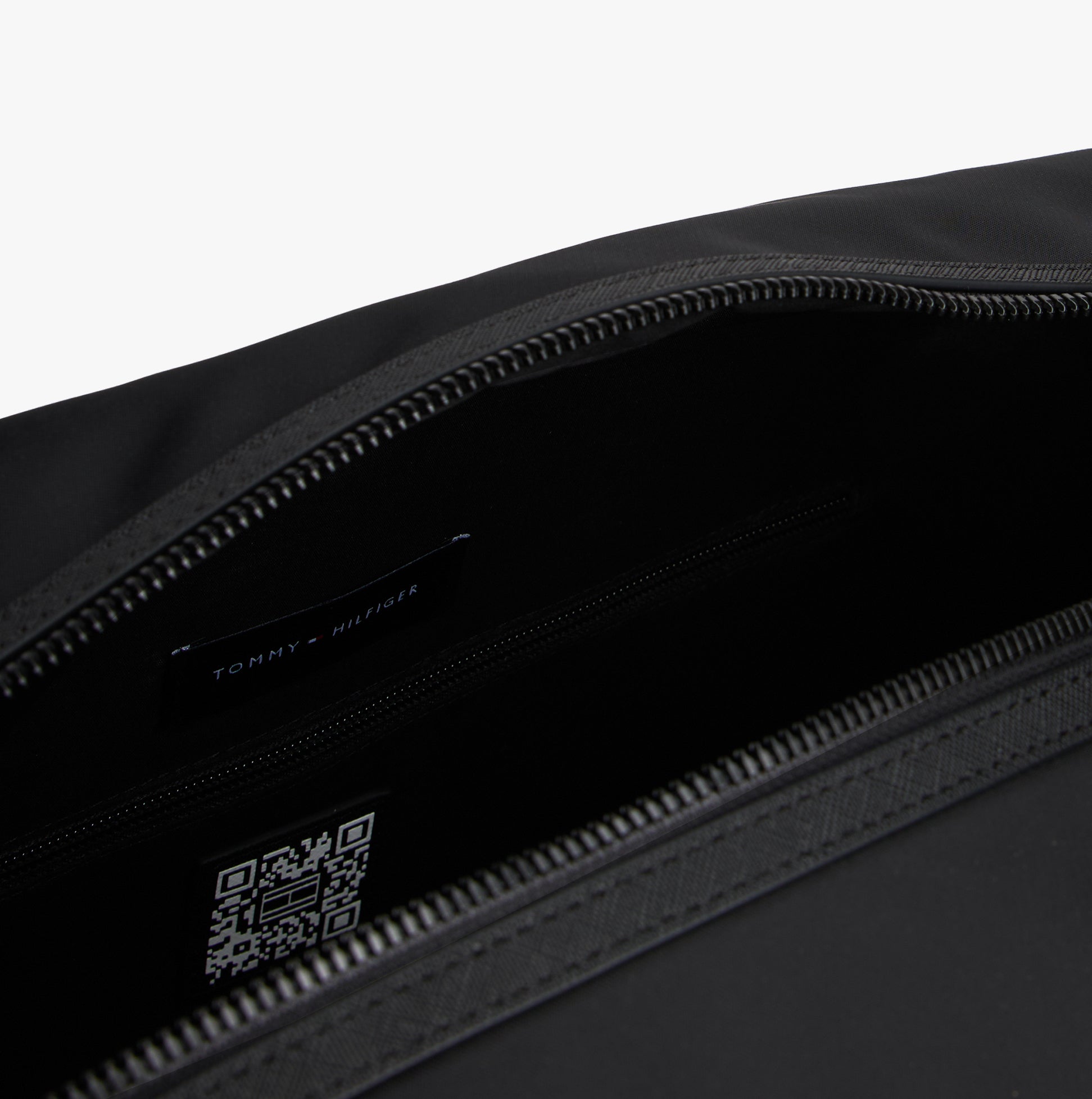 Tommy Hilfiger REPREVE DUFFLE Mens Duffle Bag Black interior detail view with zip closure and brand label.