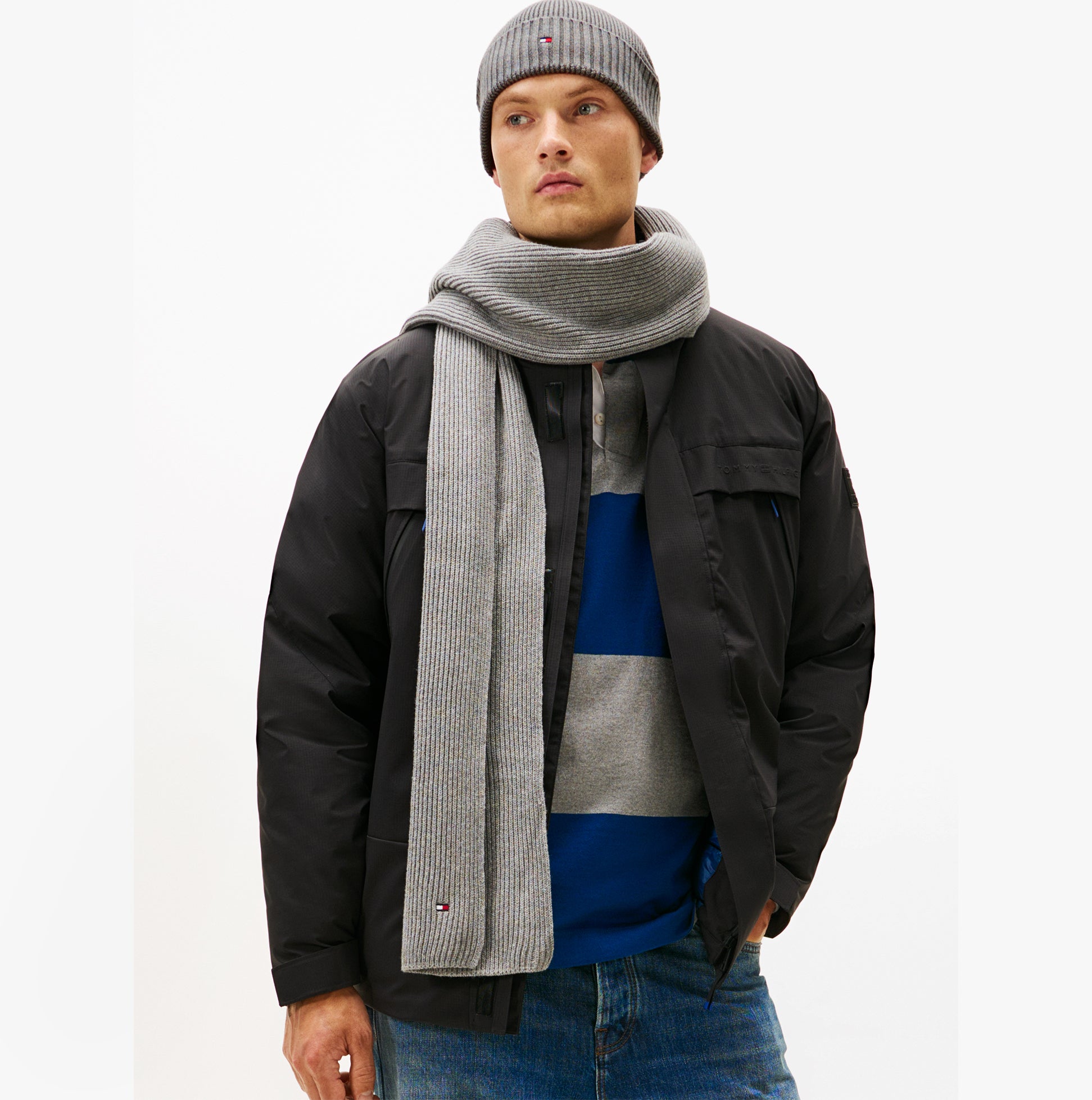Tommy Hilfiger AM0AM13807 TH FLAG BEANIE & SCA Mens Beanie Mid Grey Heather front view worn with scarf and jacket.