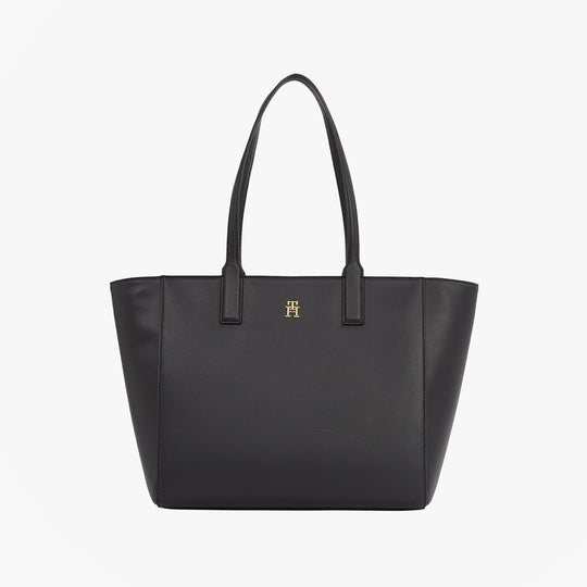 Tommy Hilfiger SOFT LOGO TOTE Womens Handbag Black front view with TH monogram plaque and two top handles.