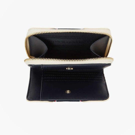 Tommy Hilfiger Womens monogram wallet with TH signature Cream inside view showing compartments and zip fastener.