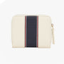 Tommy Hilfiger Womens monogram wallet with TH signature Cream front view showcasing zip closure and stylish design.