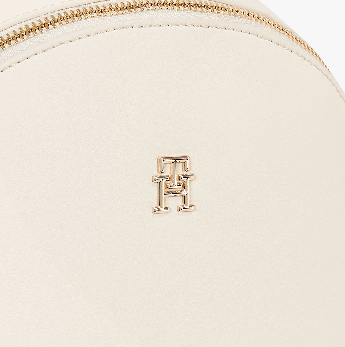 Tommy Hilfiger LOGOTAPE Womens Backpack Sugarcane detailed view of TH monogram plaque on front.