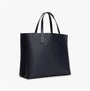 Tommy Hilfiger DISTINCT SATCHEL Ladies Handbag Space Blue side view with embossed TH design and dual handles.