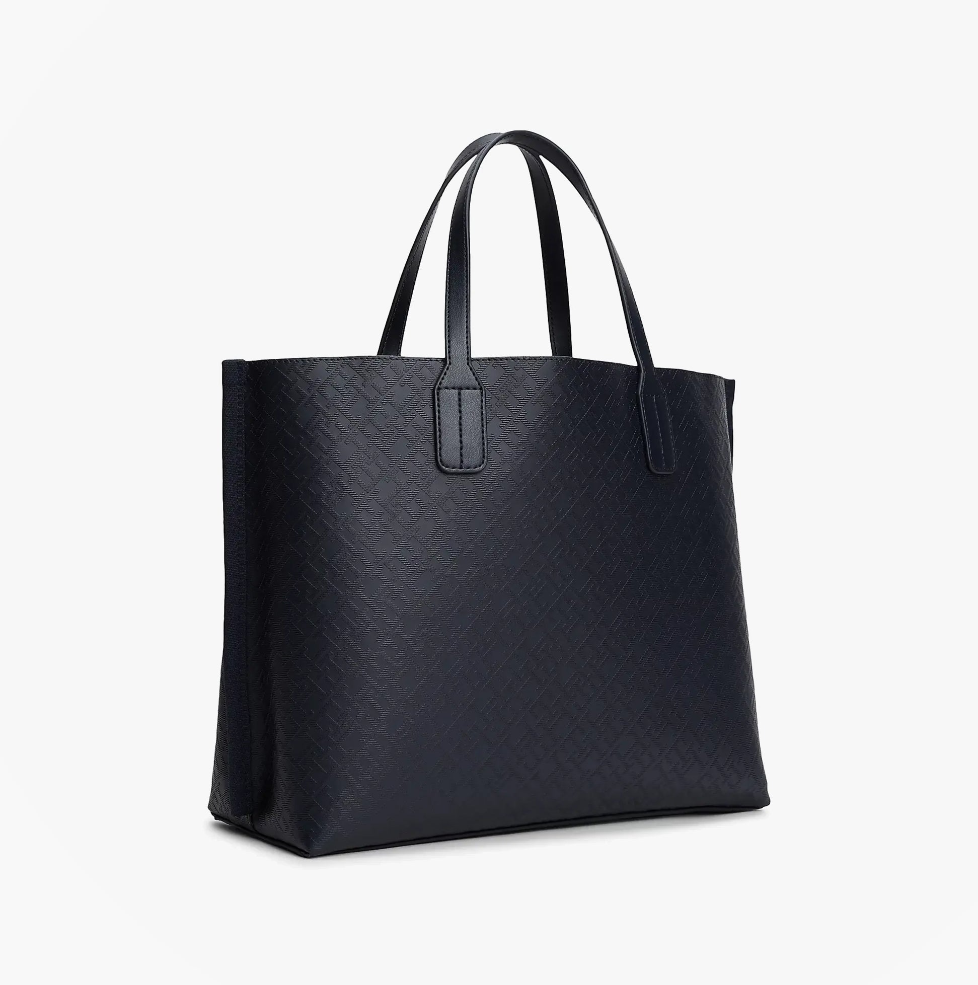 Tommy Hilfiger DISTINCT SATCHEL Ladies Handbag Space Blue side view with embossed TH design and dual handles.