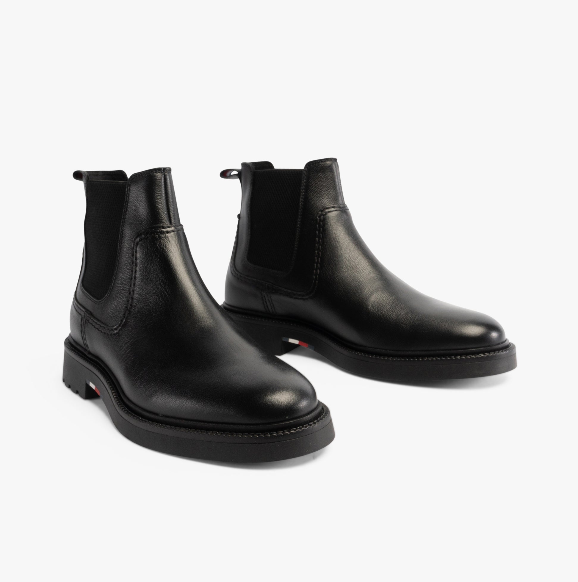 Tommy Hilfiger HILFIGER COMFORT Mens Chelsea Boots Black side view showcasing sleek leather design.