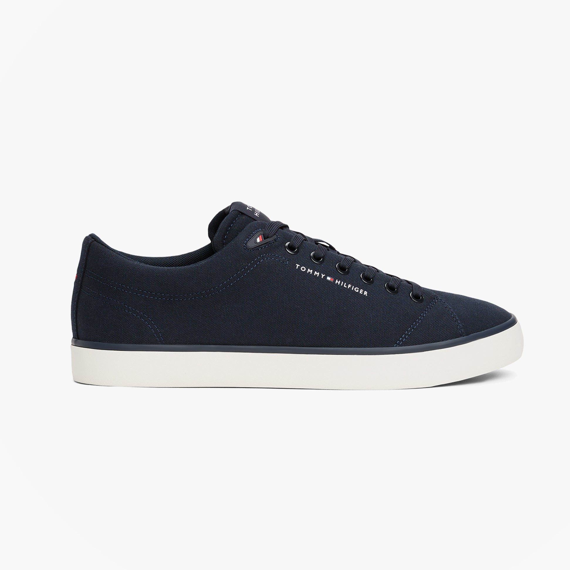 Tommy Hilfiger HI VULC LOW CORE Mens Canvas Trainers Desert Sky side view showing lace-up design and navy canvas upper.