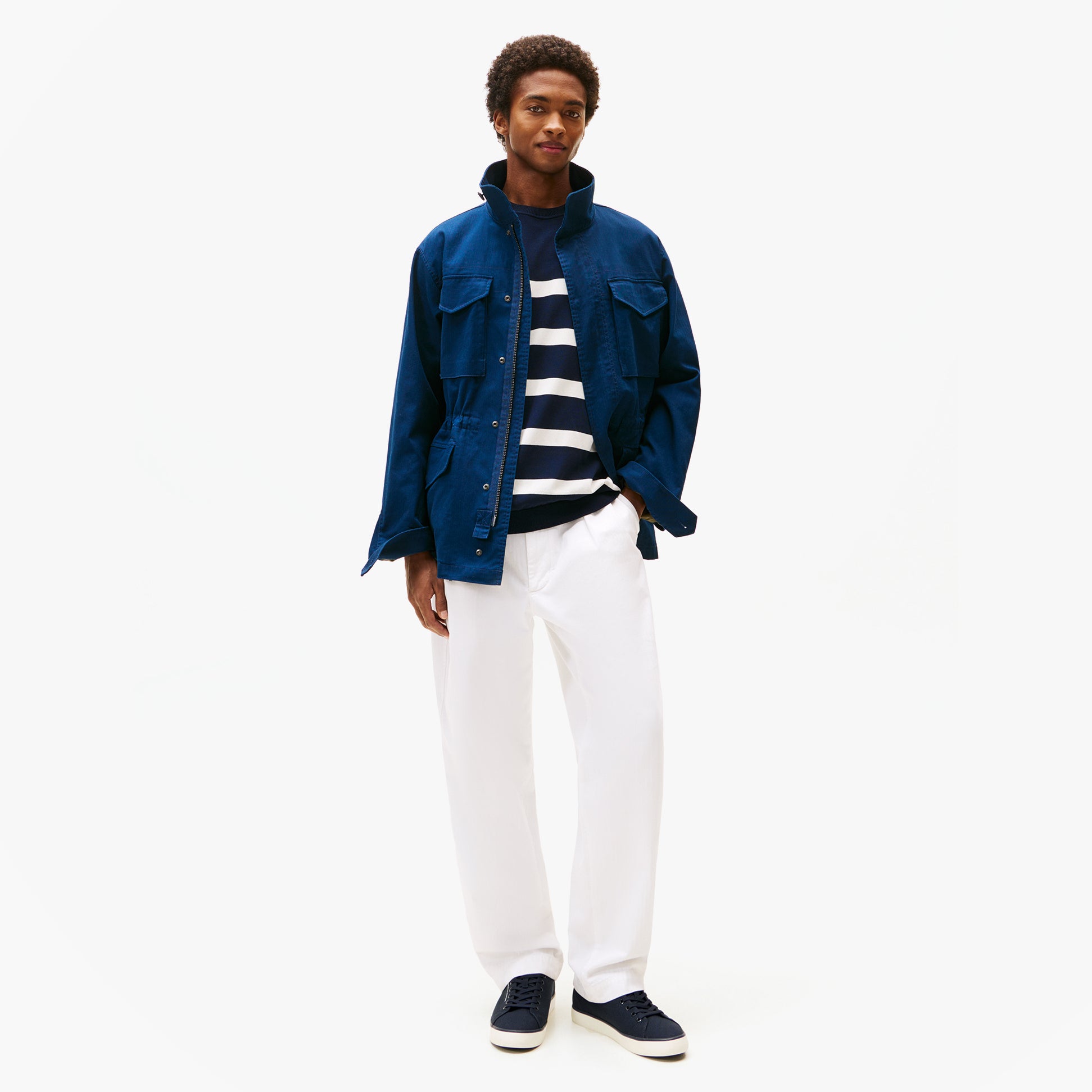 Tommy Hilfiger HI VULC LOW CORE Mens Canvas Trainers Desert Sky side view worn with navy jacket and white pants
