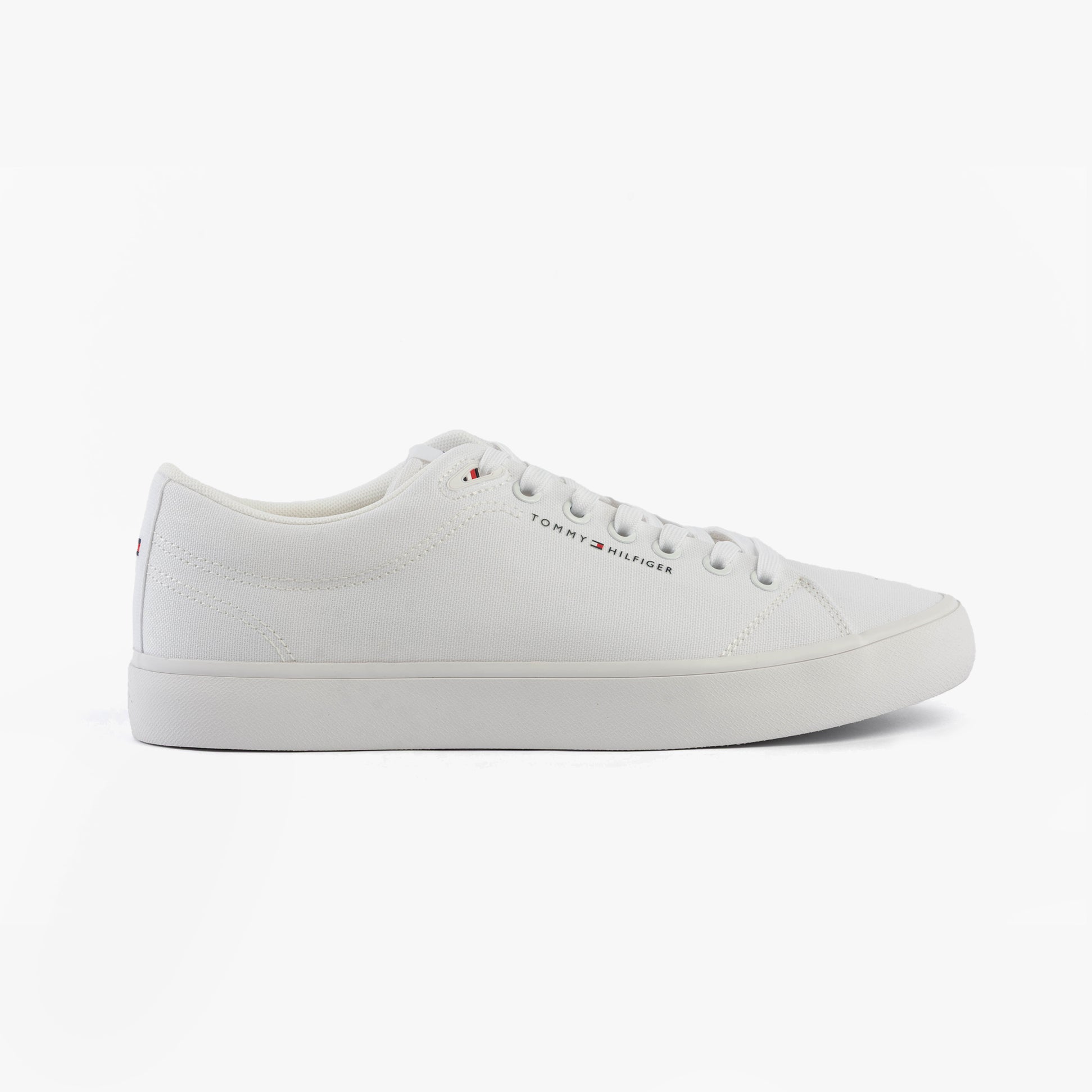 Tommy Hilfiger LOGO PATCH Mens Trainers White side view showcasing casual style and lace-up design.