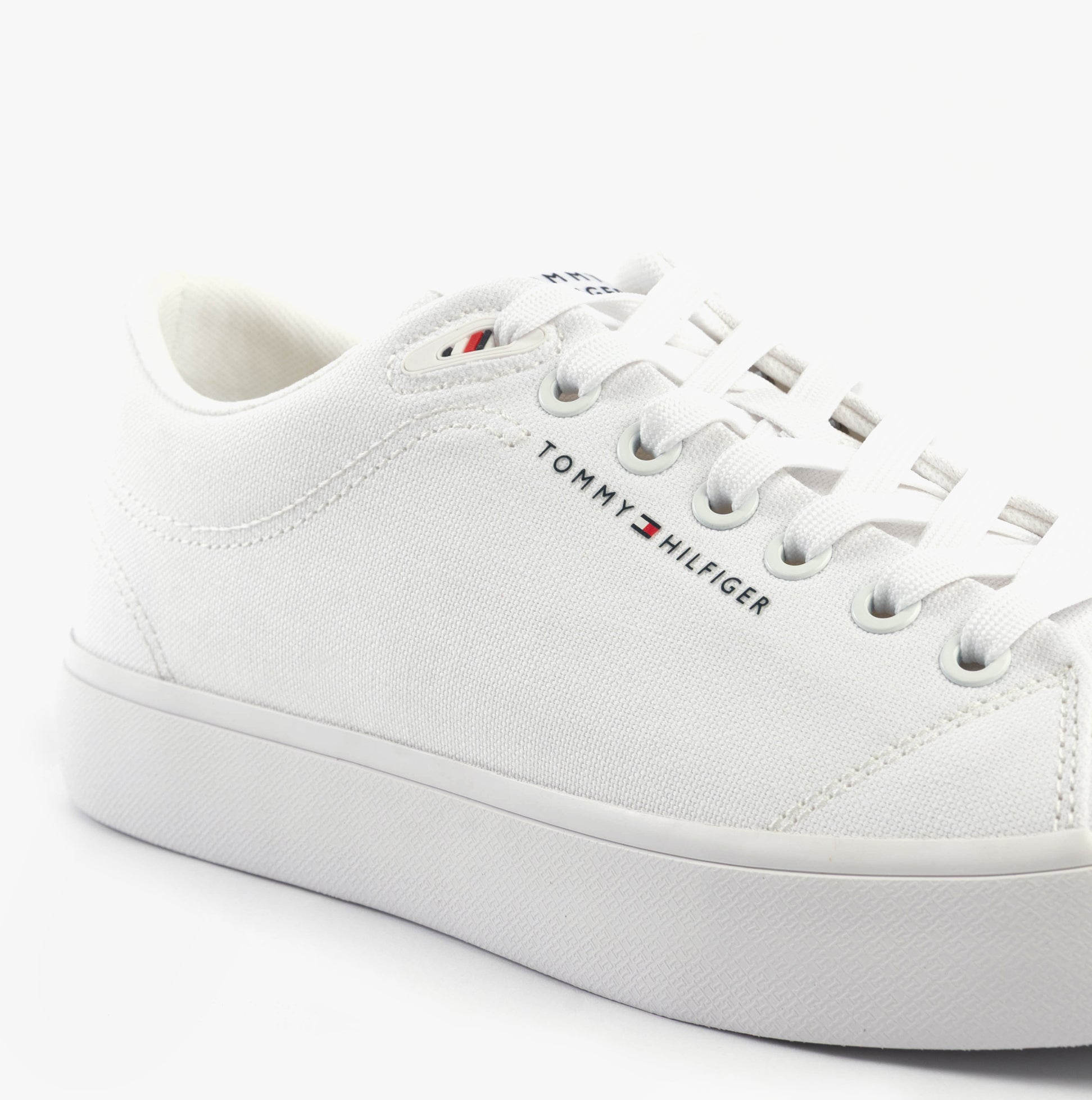 Tommy Hilfiger LOGO PATCH Mens Trainers White side view showcasing cotton upper and lace-up closure.