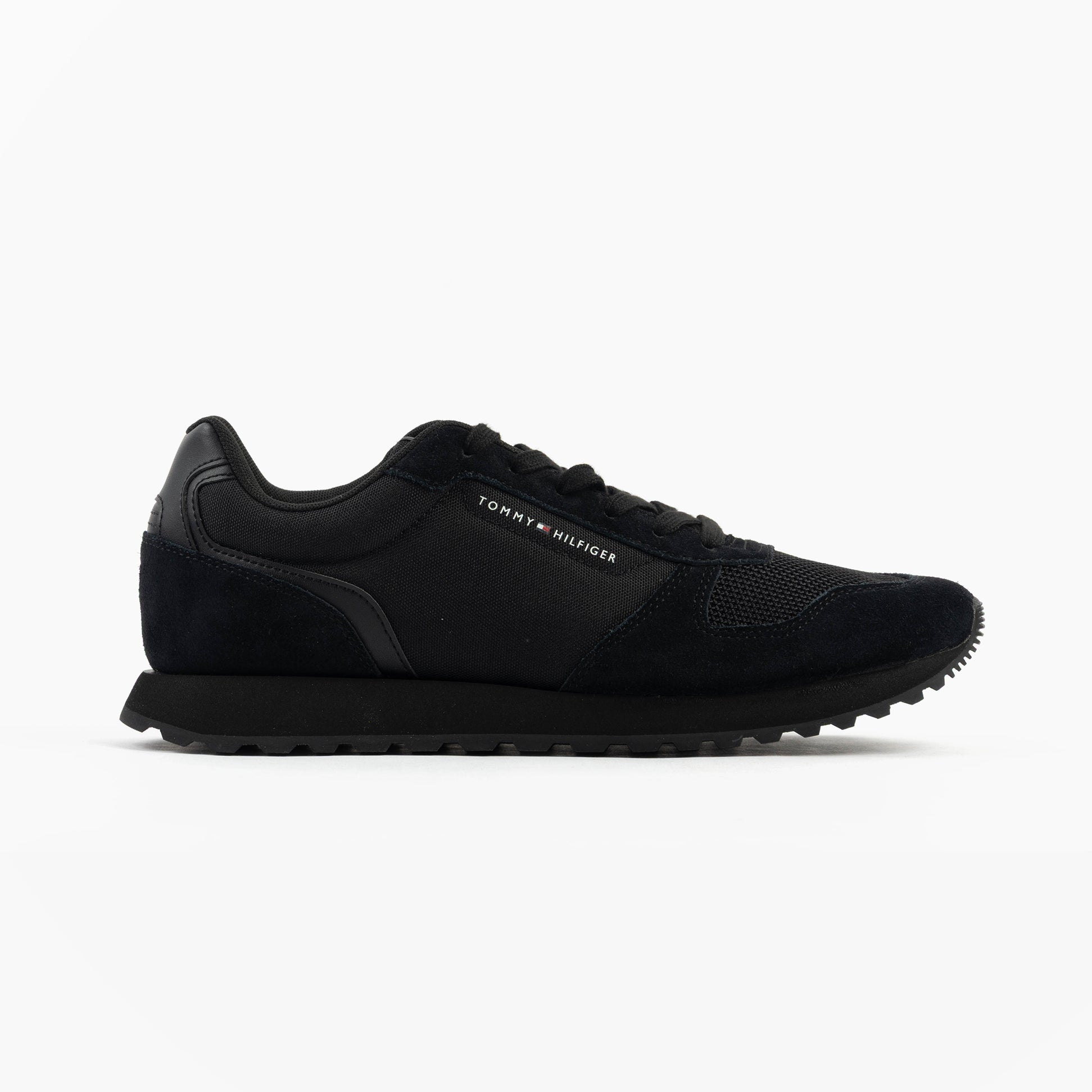 Tommy Hilfiger ESSENTIAL MIXED TEXTURE Mens Trainers Black side view showcasing the casual design and black upper.