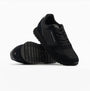 Tommy Hilfiger ESSENTIAL MIXED TEXTURE Mens Trainers Black side view showing mesh and suede design with rubber sole.